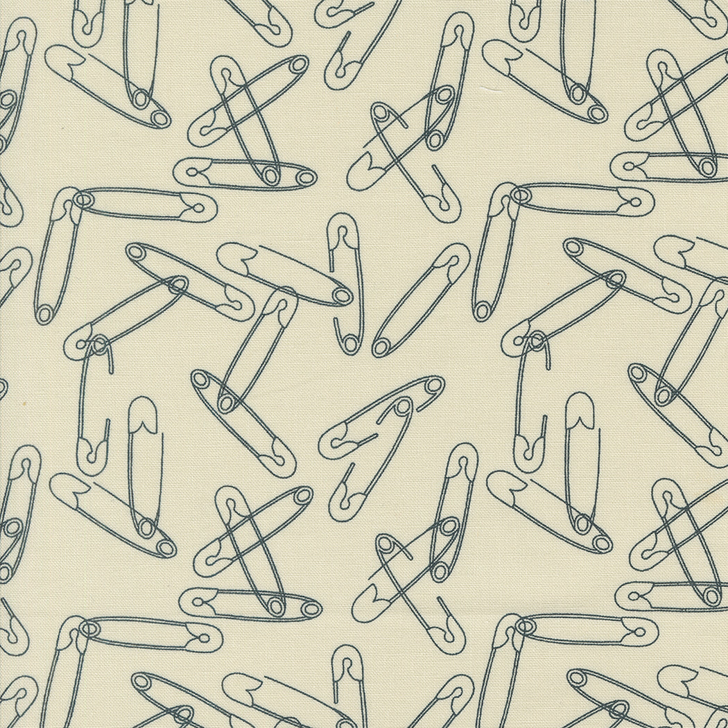 Cotton quilting fabric pattern called 'Safety Pins in Eggshell'. Part of the 'Still More Paper' fabric collection. Designed by Zen Chic for fabric company MODA. SKU: 1873 13. 44-45 inch width.