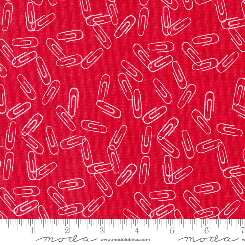 Cotton quilting fabric pattern called 'Clip It in Apple'. Part of the 'Back to School' fabric collection. Designed by Stacy Iest Hsu for fabric company MODA. SKU: 20896 14. 44-45 inch width.