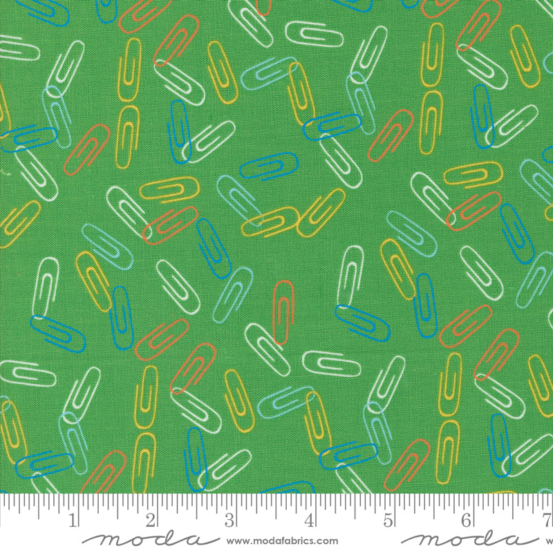 Cotton quilting fabric pattern called 'Clip It in Grass'. Part of the 'Back to School' fabric collection. Designed by Stacy Iest Hsu for fabric company MODA. SKU: 20896 17. 44-45 inch width.