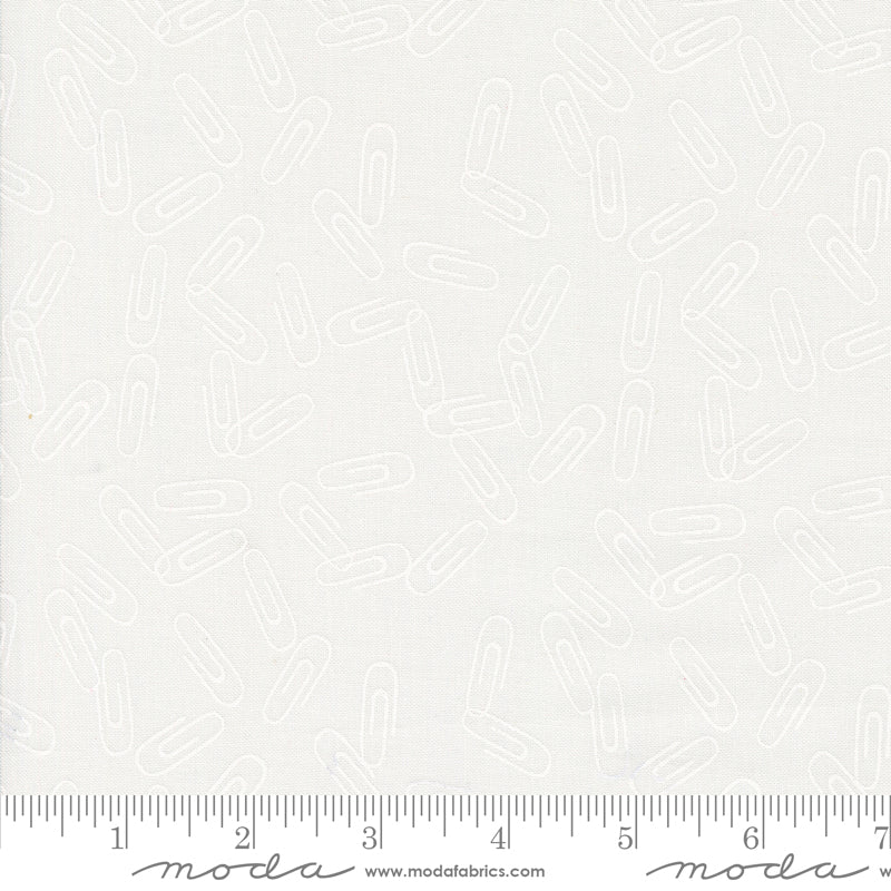 Cotton quilting fabric pattern called 'Clip It in Paper White'. Part of the 'Back to School' fabric collection. Designed by Stacy Iest Hsu for fabric company MODA. SKU: 20896 21. 44-45 inch width.