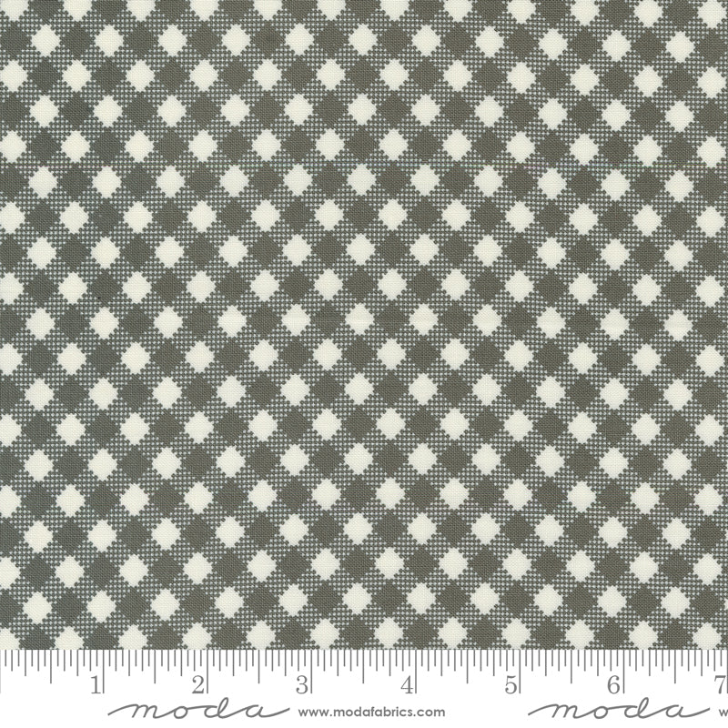 Cotton quilting fabric pattern called 'Bias Gingham in Charcoal'. Part of the 'Farmstead' fabric collection. Designed by Stacy Iest Hsu for fabric company MODA. SKU: 20907 16. 44-45 inch width.