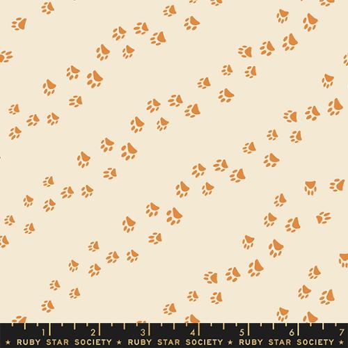 Cotton quilting fabric pattern called 'Wander Paw in Shell'. Part of the 'Dog Park' fabric collection. Designed by Sarah Watts for fabric company Ruby Star Society. SKU: RS2099 11. 44-45 inch width.