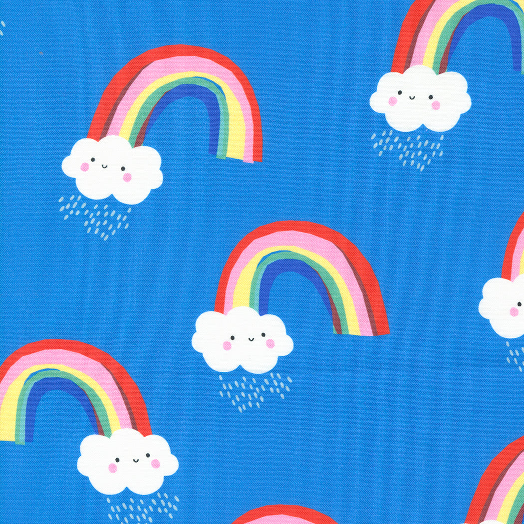 Cotton quilting fabric pattern called 'Papercut Rainbows in Bright Sky'. Part of the 'Whatever the Weather' fabric collection. Designed by Paper + Cloth for fabric company Moda Fabrics. SKU: 25145 13. 44-45 inch width.