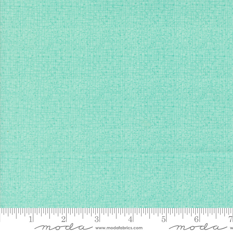 Cotton quilting fabric pattern called 'Thatched in Aqua'. Part of the 'Serena Shores' fabric collection. Designed by Robin Pickens for fabric company Moda. SKU: 48626 212. 44-45 inch width.