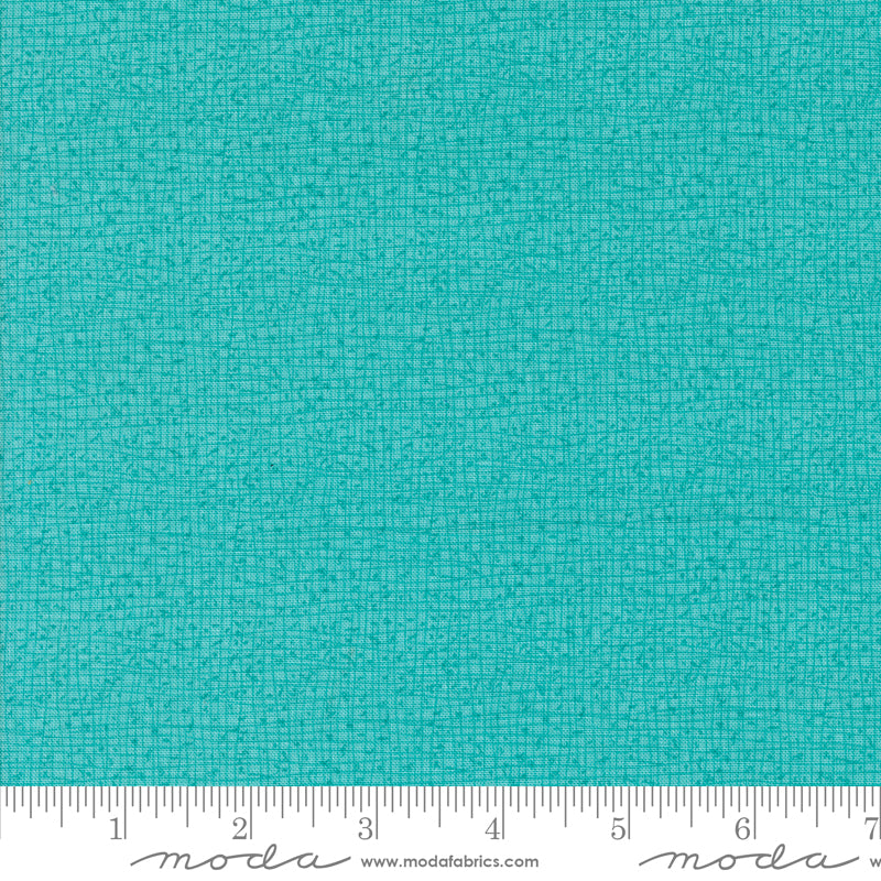 Cotton quilting fabric pattern called 'Thatched in Surf'. Part of the 'Serena Shores' fabric collection. Designed by Robin Pickens for fabric company Moda. SKU: 48626 213. 44-45 inch width.