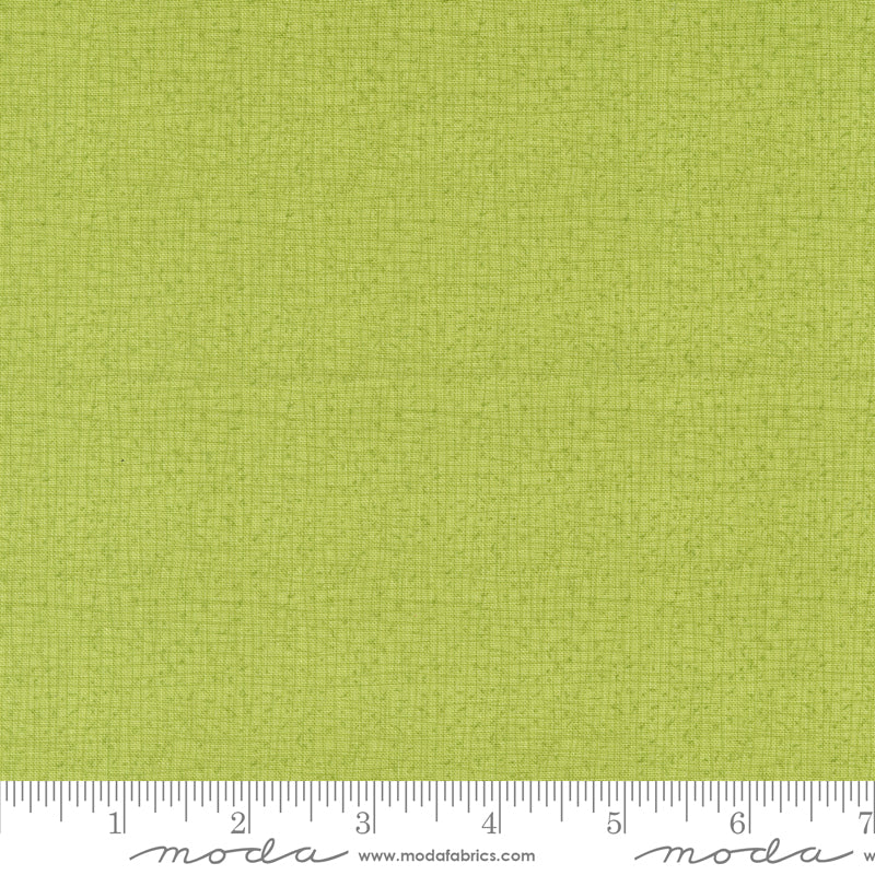 Cotton quilting fabric pattern called 'Thatched in Lime'. Part of the 'Serena Shores' fabric collection. Designed by Robin Pickens for fabric company Moda. SKU: 48626 214. 44-45 inch width.