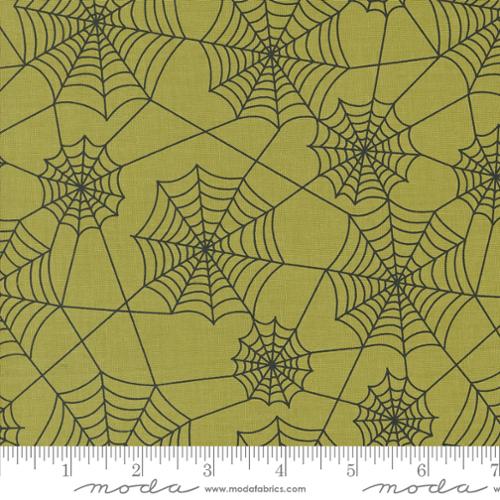 Cotton quilting fabric pattern called 'Webs in Witchy Green'. Part of the 'Hey Boo' fabric collection. Designed by Lella Boutique for fabric company Moda. SKU: 5213 17. 44-45 inch width.