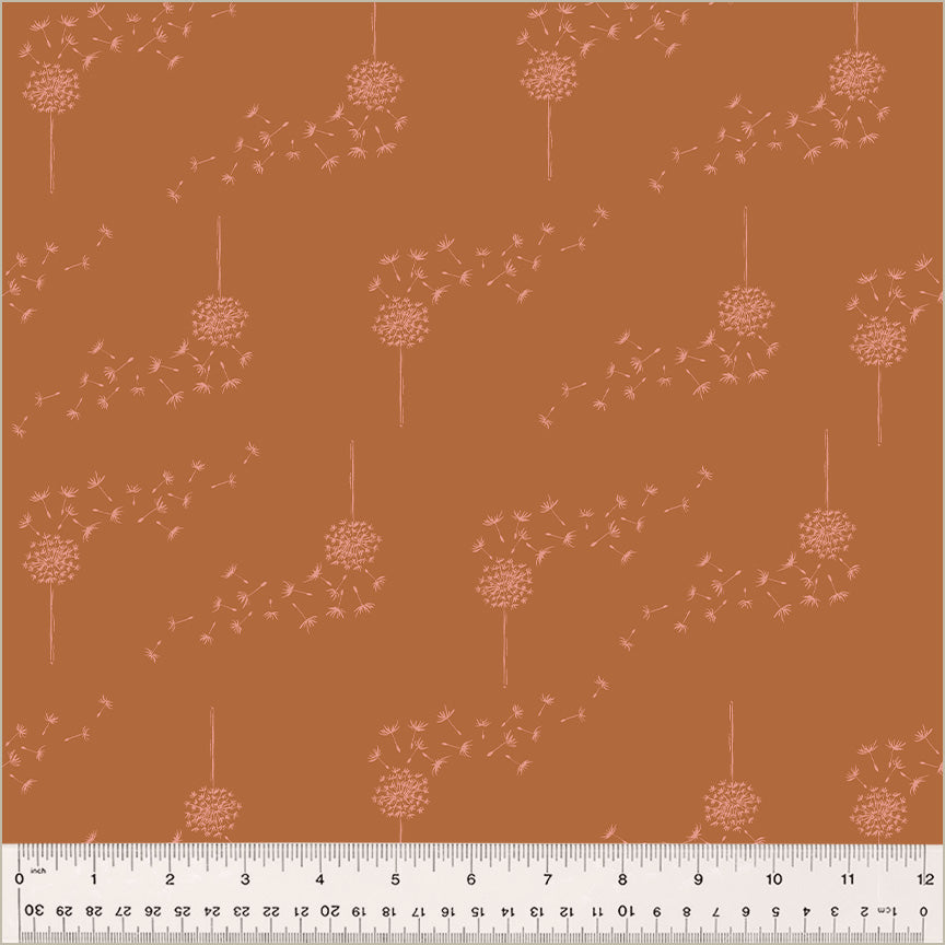 Cotton quilting fabric pattern called 'Wish in Pumpkin'. Part of the 'Moonlit' fabric collection. Designed by Jennifer Moore / Monaluna for fabric company Windham Fabrics. SKU: 54290-5. 44-45 inch width.