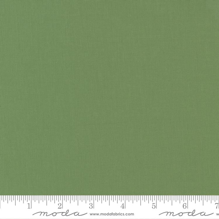 Cotton quilting fabric pattern called 'Prairie Green'. Part of the 'Bella Solids' fabric collection. Designed by Moda Fabrics for fabric company Moda Fabrics. SKU: 9900 102. 44-45 inch width.