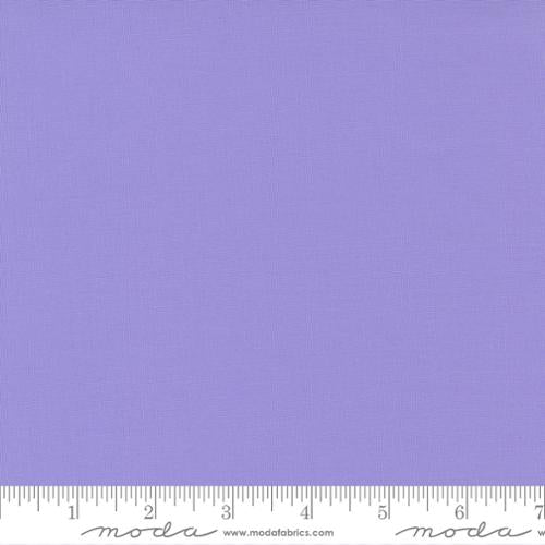 Cotton quilting fabric pattern called 'Amelia Lavender'. Part of the 'Bella Solids' fabric collection. Designed by Moda Fabrics for fabric company Moda Fabrics. SKU: 9900 164. 44-45 inch width.