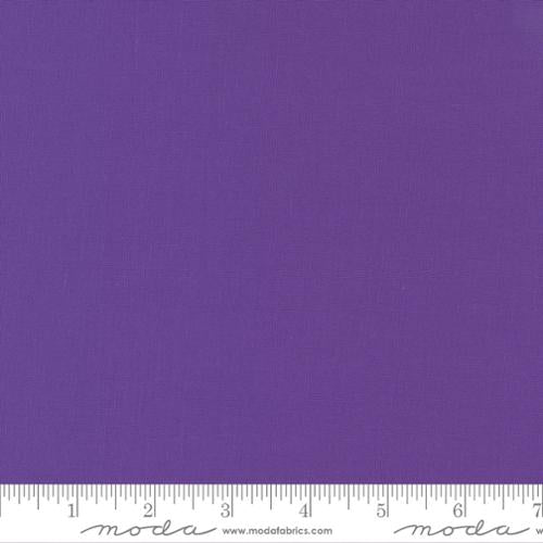 Cotton quilting fabric pattern called 'Vivid Violet'. Part of the 'Bella Solids' fabric collection. Designed by Moda for fabric company Moda. SKU: 9900 413. 44-45 inch width.