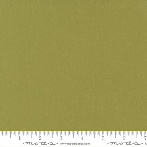 Cotton quilting fabric pattern called 'Fig Tree Olive'. Part of the 'Bella Solids' fabric collection. Designed by Moda for fabric company Moda. SKU: 9900 69. 44-45 inch width.