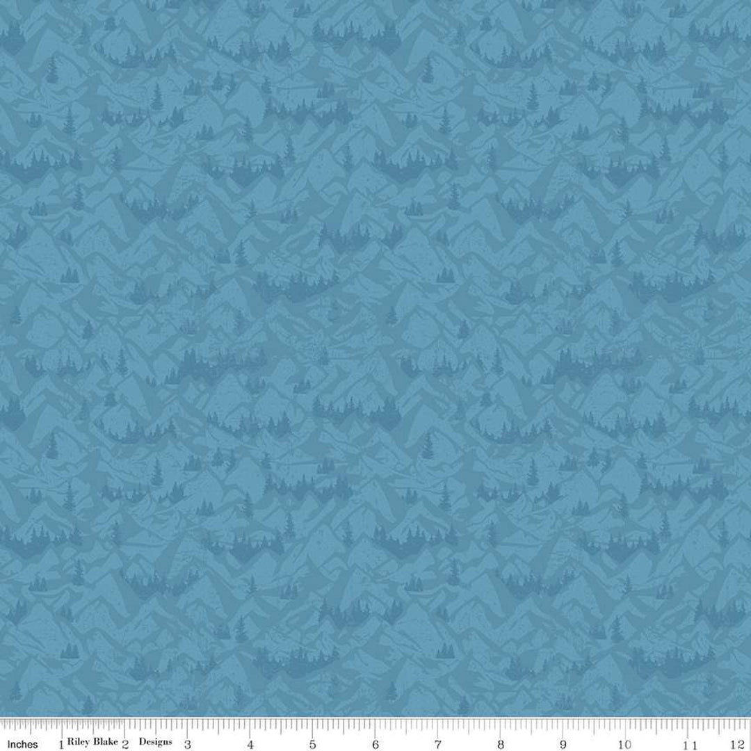 Cotton quilting fabric pattern called 'Mountains in Blue'. Part of the 'Legends of the National Parks' fabric collection. Designed by Anderson Design Group for fabric company Riley Blake. SKU: C13284-BLUE. 44-45 inch width.