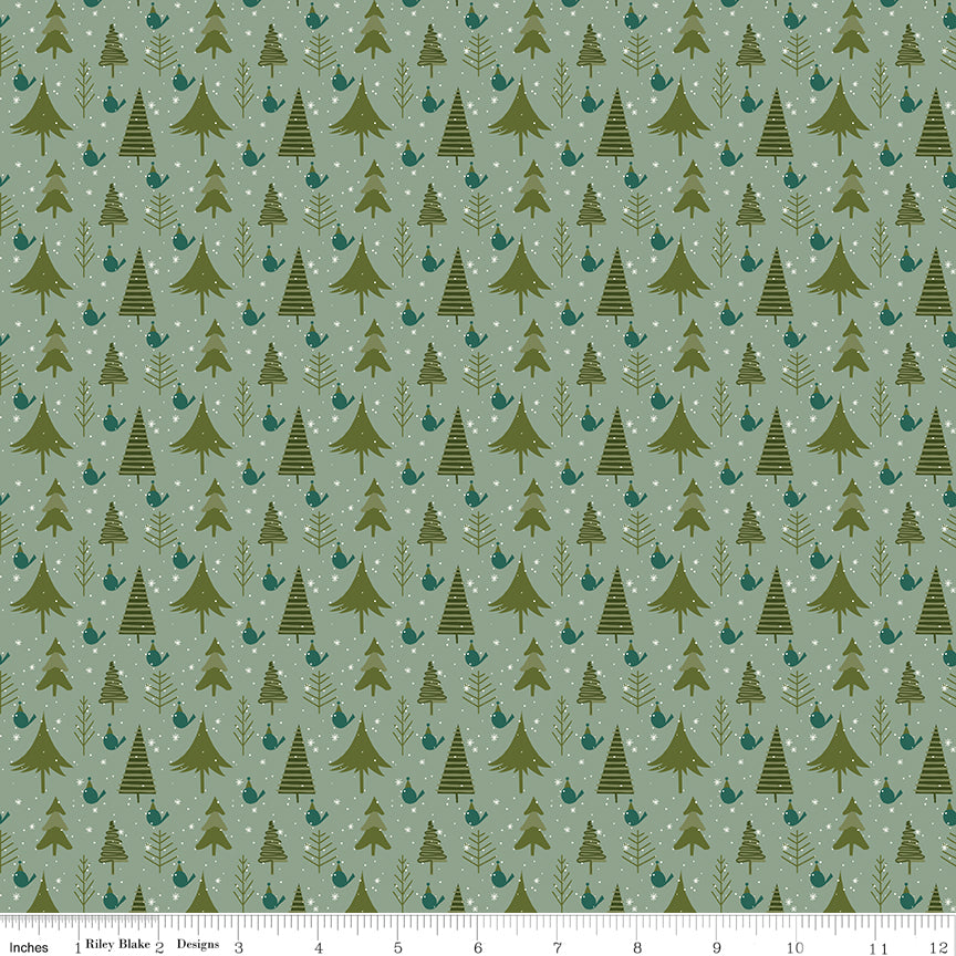 Cotton quilting fabric pattern called 'Trees in Sage'. Part of the 'Christmas is in Town' fabric collection. Designed by Sandy Gervais for fabric company Riley Blake. SKU: C14744-SAGE. 44-45 inch width.