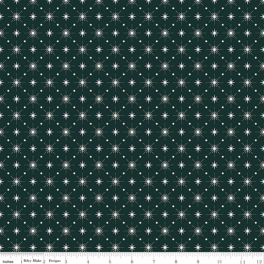 Cotton quilting fabric pattern called 'Stars in Forest'. Part of the 'Christmas is in Town' fabric collection. Designed by Sandy Gervais for fabric company Riley Blake. SKU: C14747-FOREST. 44-45 inch width.