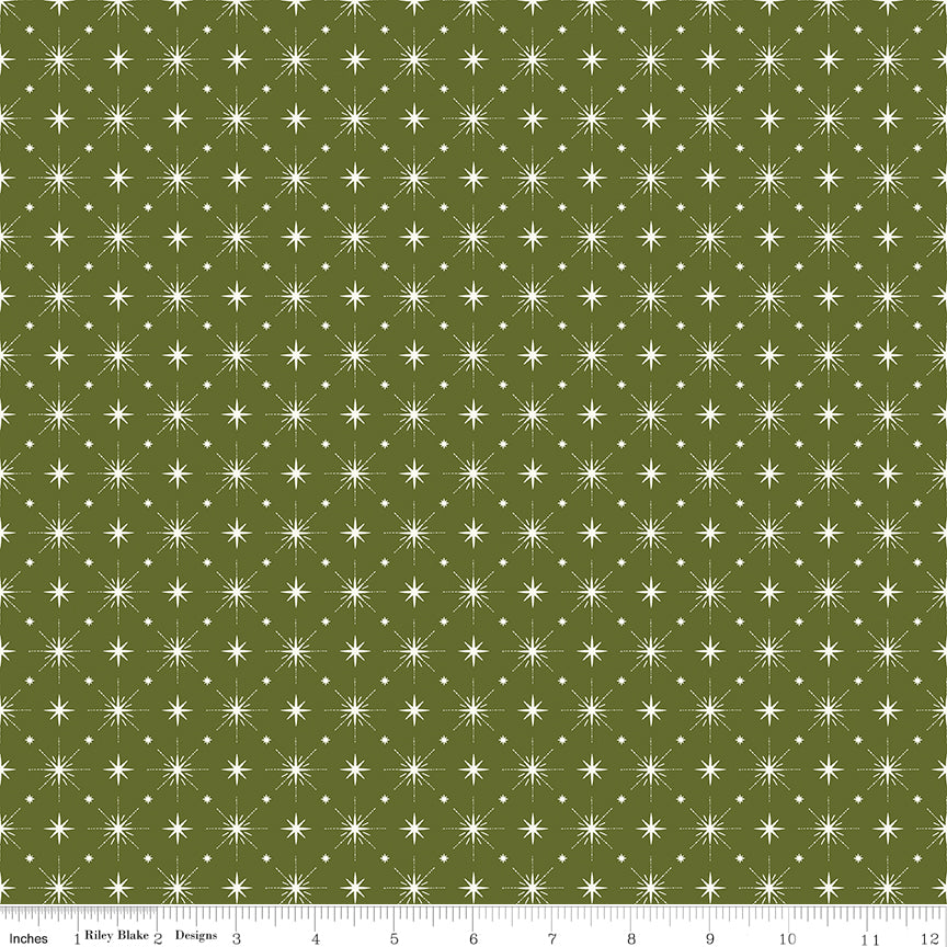 Cotton quilting fabric pattern called 'Stars in Green'. Part of the 'Christmas is in Town' fabric collection. Designed by Sandy Gervais for fabric company Riley Blake. SKU: C14747-GREEN. 44-45 inch width.