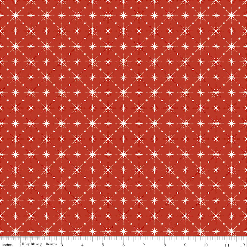 Cotton quilting fabric pattern called 'Stars in Red'. Part of the 'Christmas is in Town' fabric collection. Designed by Sandy Gervais for fabric company Riley Blake. SKU: C14747-RED. 44-45 inch width.