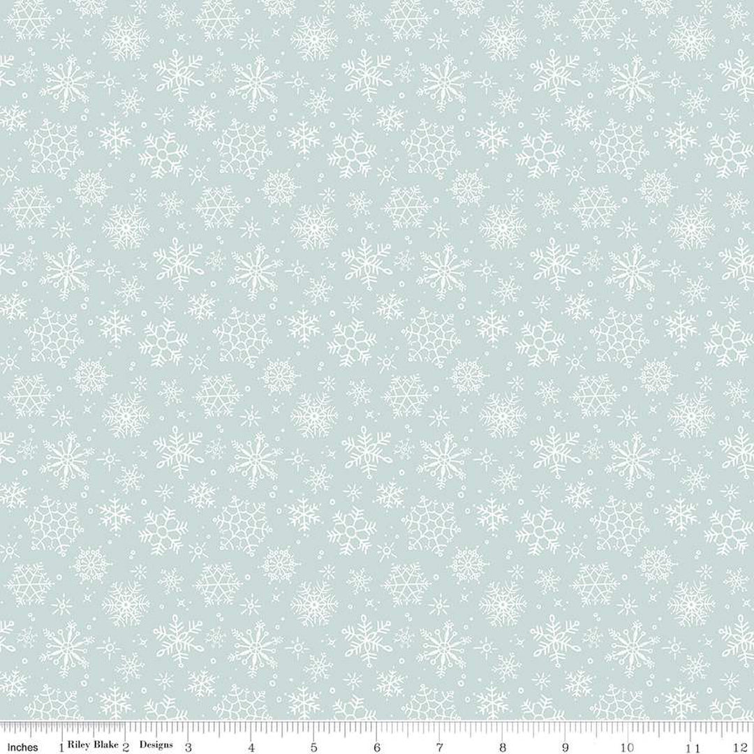 Cotton quilting fabric pattern called 'Snowflake in Blue'. Part of the 'Magical Winterland' fabric collection. Designed by Lisa Audit for fabric company Riley Blake. SKU: C14944-BLUE. 44-45 inch width.