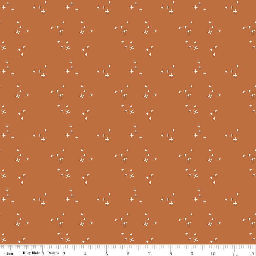 Cotton quilting fabric pattern called 'Sparkle in Spice'. Part of the 'Pumpkin Spice' fabric collection. Designed by Simple Simon & Company for fabric company Riley Blake. SKU: C14994-SPICE. 44-45 inch width.