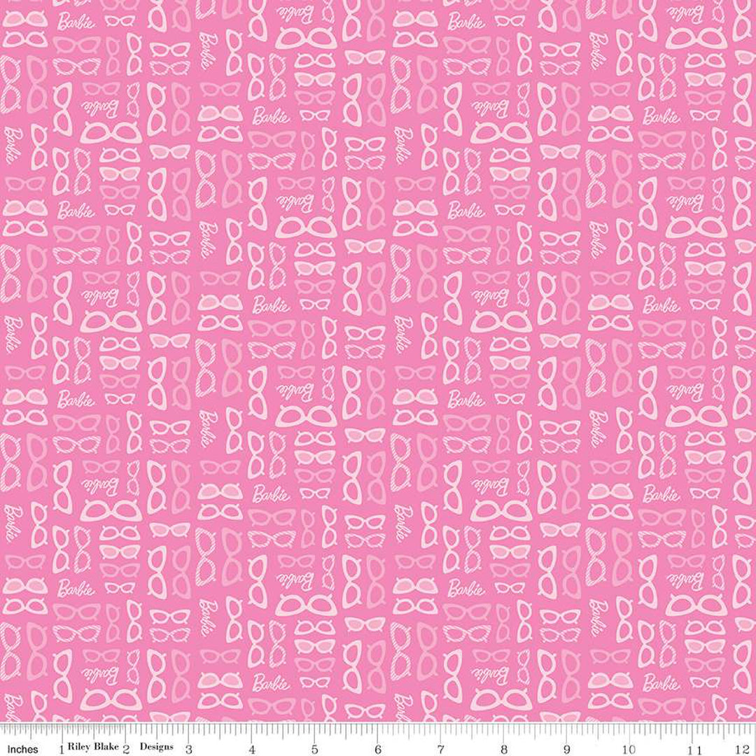 Cotton quilting fabric pattern called 'Barbie Glasses Medium Pink'. Part of the 'Barbie World' fabric collection. Designed by Riley Blake Designs for fabric company Riley Blake. SKU: C15025-MEDPINK. 44-45 inch width.