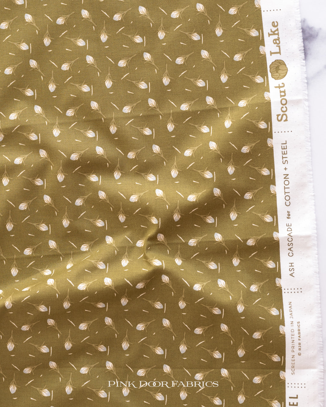 Cotton quilting fabric pattern called 'Thistle in Olive'. Part of the 'Scout Lake' fabric collection. Designed by Ash Cascade for fabric company RJR Fabrics. SKU: AC402-OL3. 44-45 inch width.