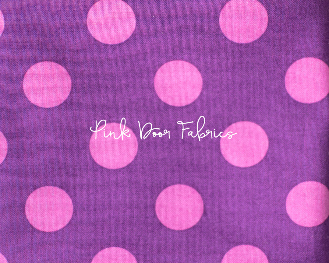 Cotton quilting fabric pattern called 'Pom Poms in Foxglove'. Part of the 'True Colors' fabric collection. Designed by Tula Pink for fabric company Free Spirit Fabrics. SKU: PWTP118.FOXGLOVE. 44-45 inch width.