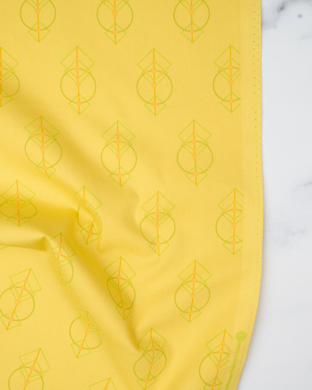 Cotton quilting fabric pattern called 'Talisman in Lemon'. Part of the 'Deco Glo II' fabric collection. Designed by Giucy Giuce for fabric company Andover Fabrics. SKU: CS-786-Y. 44-45 inch width.