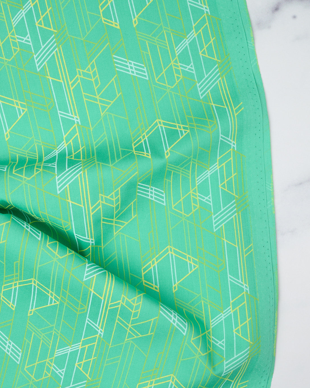 Cotton quilting fabric pattern called 'Meander in Key Lime'. Part of the 'Deco Glo II' fabric collection. Designed by Giucy Giuce for fabric company Andover Fabrics. SKU: CS-276-G. 44-45 inch width.