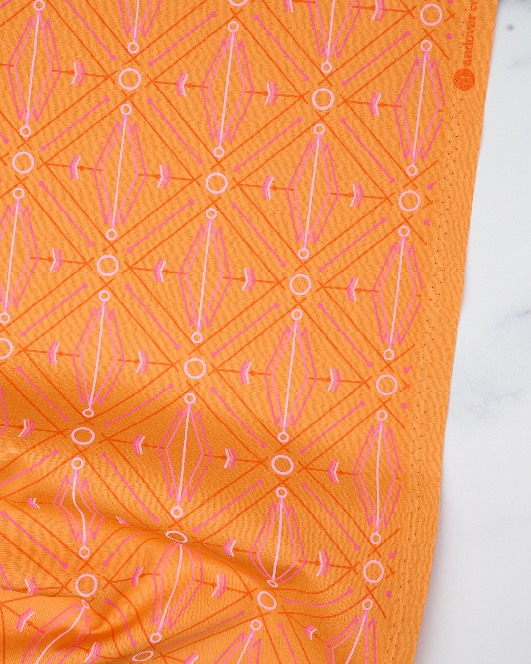 Cotton quilting fabric pattern called 'Lotus in Mango'. Part of the 'Deco Glo II' fabric collection. Designed by Giucy Giuce for fabric company Andover Fabrics. SKU: CS-789-B. 44-45 inch width.