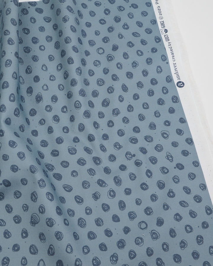 Cotton quilting fabric pattern called 'Polka in Rhino'. Part of the 'Ink by Giucy Giuce' fabric collection. Designed by Giucy Giuce for fabric company Andover Fabrics. SKU: A-915-C. 44-45 inch width.