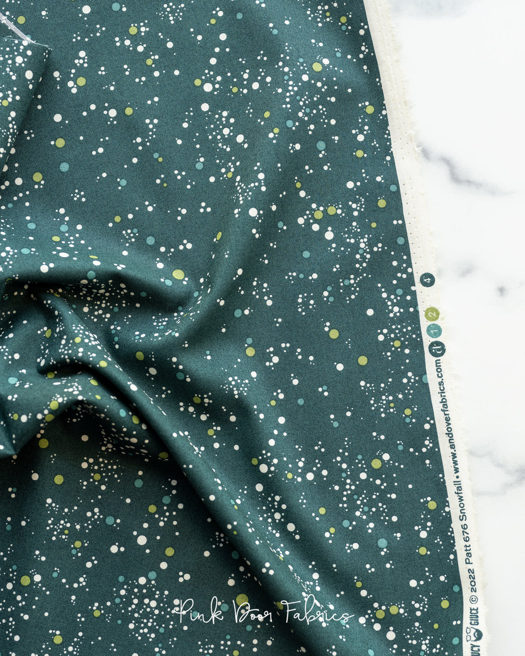 Cotton quilting fabric pattern called 'Snowfall Dots in Verde Acqua'. Part of the 'Natale' fabric collection. Designed by Giucy Giuce for fabric company Andover Fabrics. SKU: A-676-G. 44-45 inch width.