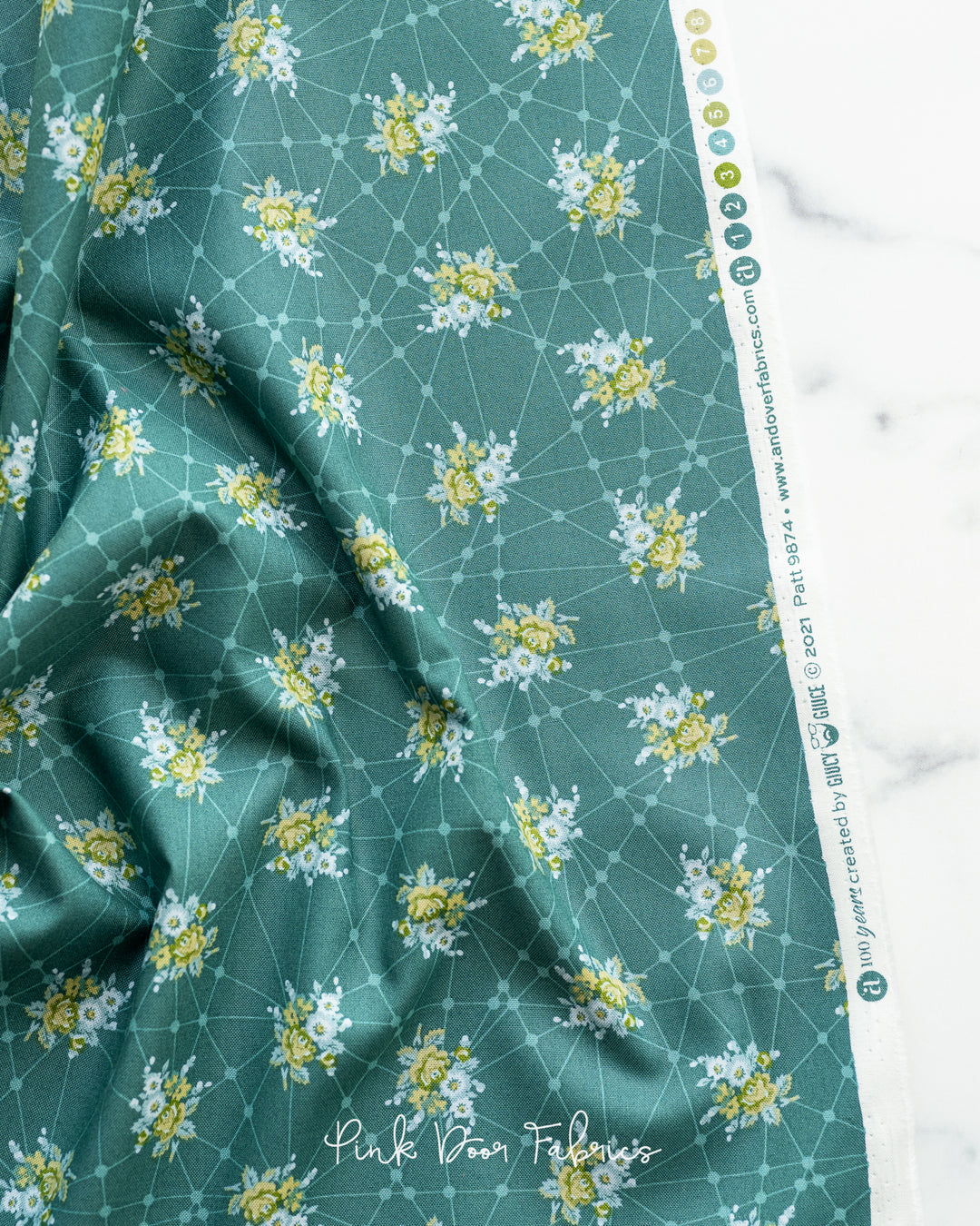 Cotton quilting fabric pattern called 'Little Bouquets in Verde Acgua'. Part of the 'Natale' fabric collection. Designed by Giucy Giuce for fabric company Andover Fabrics. SKU: A-9874-T. 44-45 inch width.