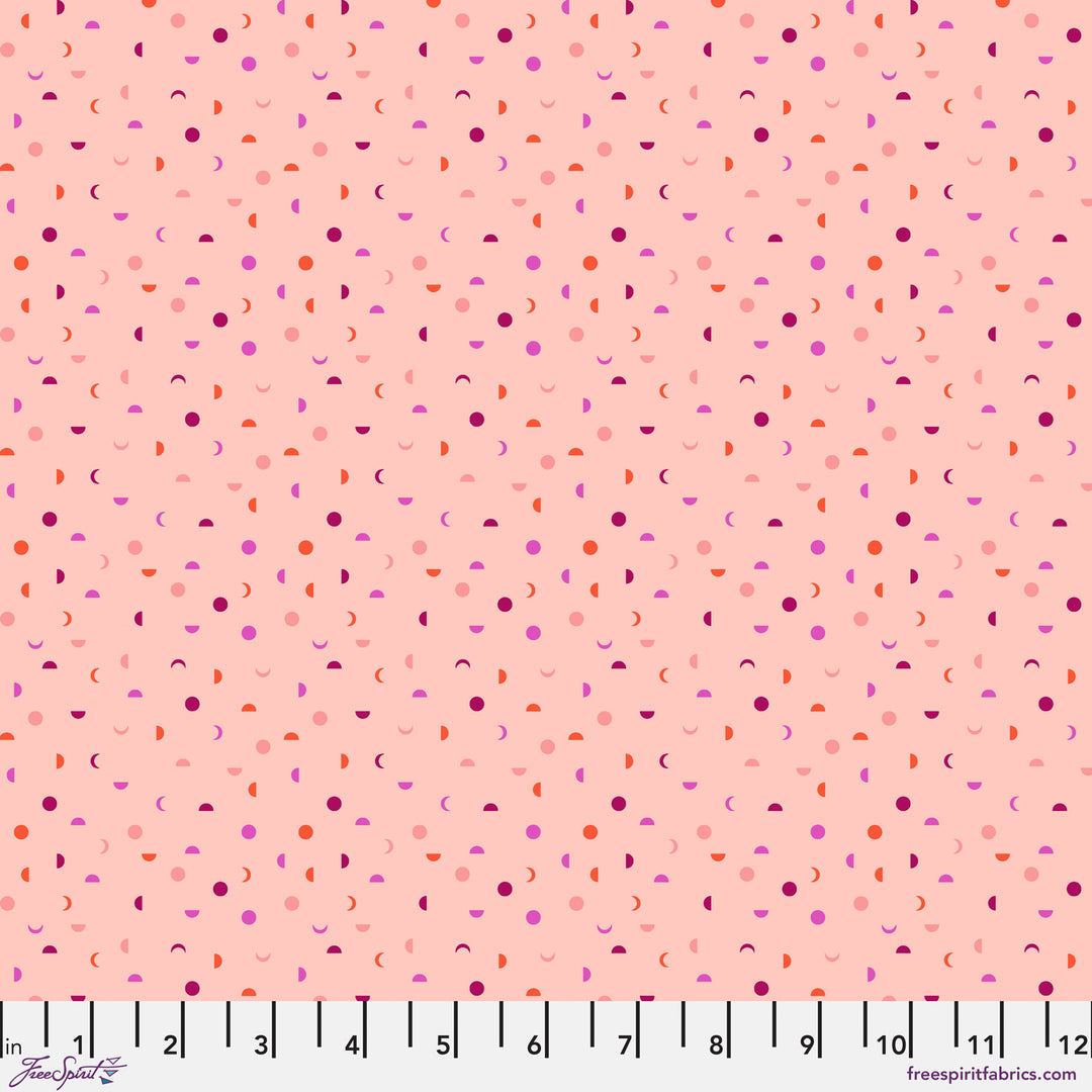 Cotton quilting fabric pattern called 'It's a Phase in Blush'. Part of the 'Mythical' fabric collection. Designed by Stacy Peterson for fabric company FreeSpirit Fabrics. SKU: PWST014.XBLUSH. 44-45 inch width.