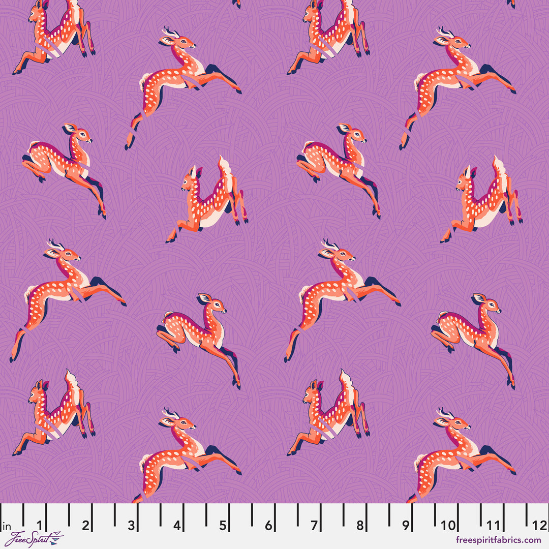 Cotton quilting fabric pattern called 'Wild Meadow in Lavender'. Part of the 'Mythical' fabric collection. Designed by Stacy Peterson for fabric company FreeSpirit Fabrics. SKU: PWST015.XLAVENDER. 44-45 inch width.