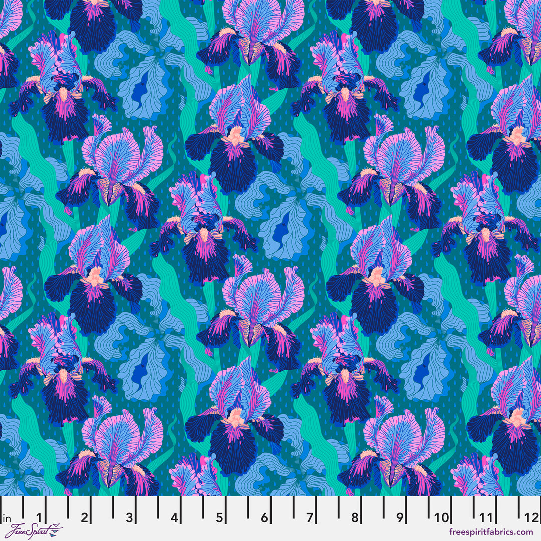 Cotton quilting fabric pattern called 'Small Mythical Iris in Deep Blue'. Part of the 'Mythical' fabric collection. Designed by Stacy Peterson for fabric company FreeSpirit Fabrics. SKU: PWST018.XDEEPBLUE. 44-45 inch width.