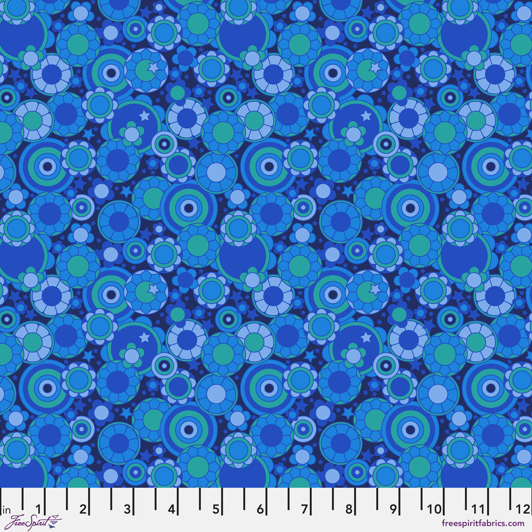 Cotton quilting fabric pattern called 'Mythical Bloom in Blue'. Part of the 'Mythical' fabric collection. Designed by Stacy Peterson for fabric company FreeSpirit Fabrics. SKU: PWST020.XBLUE. 44-45 inch width.