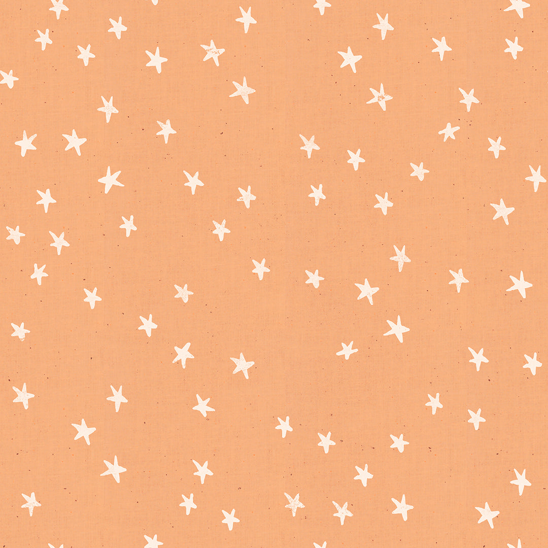 Cotton quilting fabric pattern called 'Starry in Warm Peach'. Part of the 'Starry' fabric collection. Designed by Alexia Abegg for fabric company Moda Fabrics. SKU: RS4006 17. 44-45 inch width.