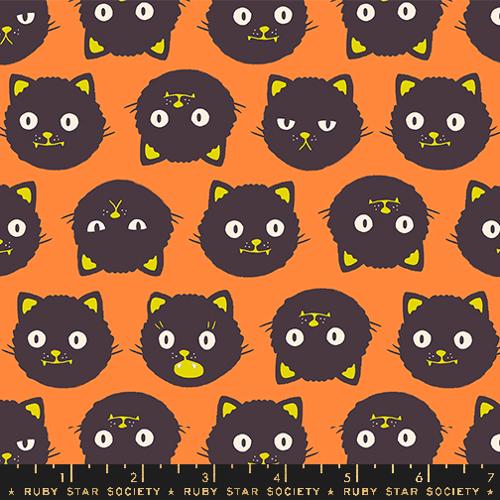 Cotton quilting fabric pattern called 'Scaredy Cats in Pumpkin'. Part of the 'Good Spirits' fabric collection. Designed by Ruby Star Society for fabric company Moda. SKU: RS5137 12G. 44-45 inch width.