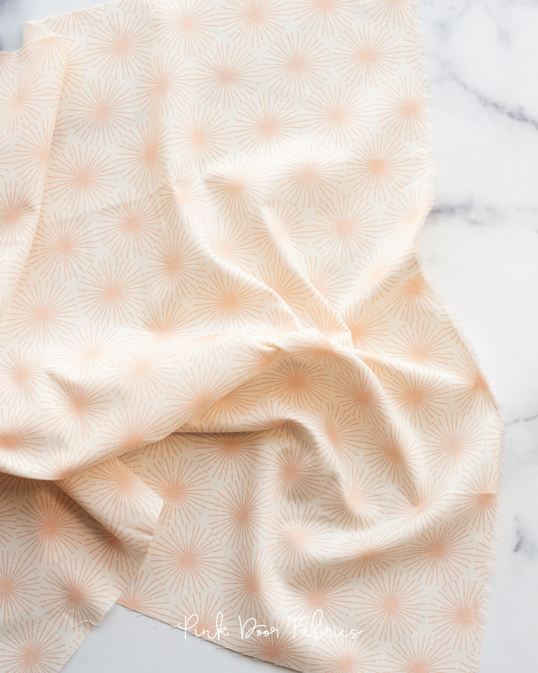 Cotton quilting fabric pattern called 'Beaming in Peach'. Part of the 'Sunbeam' fabric collection. Designed by Rashida Coleman Hale for fabric company Moda Fabrics. SKU: RS1063 14. 44-45 inch width.