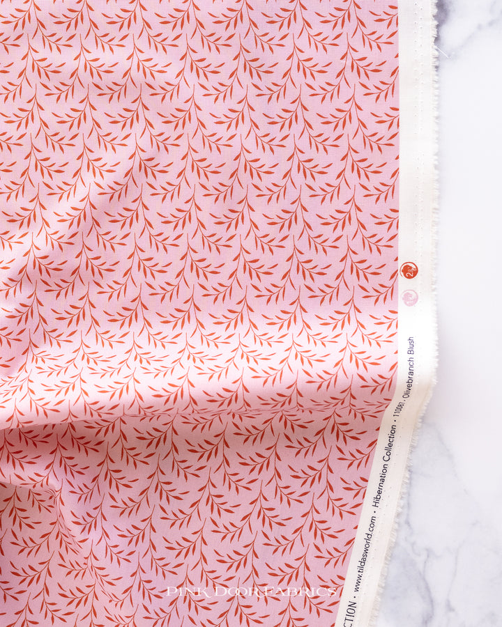 Cotton quilting fabric pattern called 'Olive Branch in Blush'. Part of the 'Hibernation' fabric collection. Designed by Tilda Fabrics for fabric company Tilda Fabrics. SKU: 110087. 44-45 inch width.