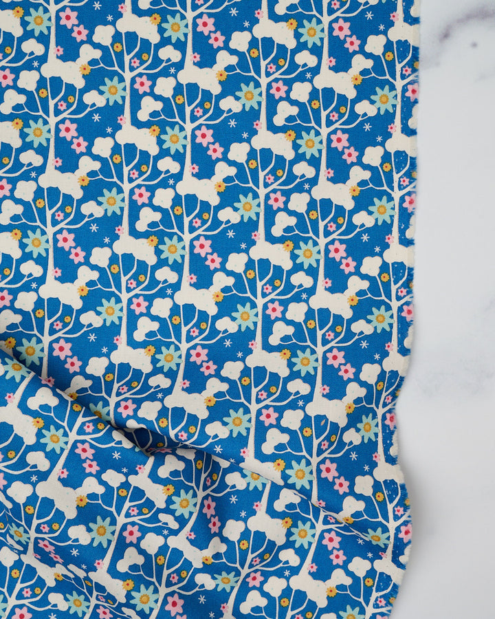 Cotton quilting fabric pattern called 'Wildgarden in Blue'. Part of the 'Jubilee' fabric collection. Designed by Tilda Fabrics for fabric company Tilda Fabrics. SKU: 100552. 44-45 inch width.