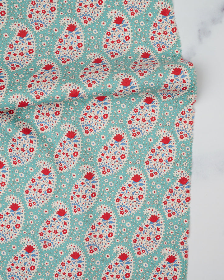 Cotton quilting fabric pattern called 'Teardrop in Teal'. Part of the 'Jubilee' fabric collection. Designed by Tilda Fabrics for fabric company Tilda Fabrics. SKU: 100556. 44-45 inch width.