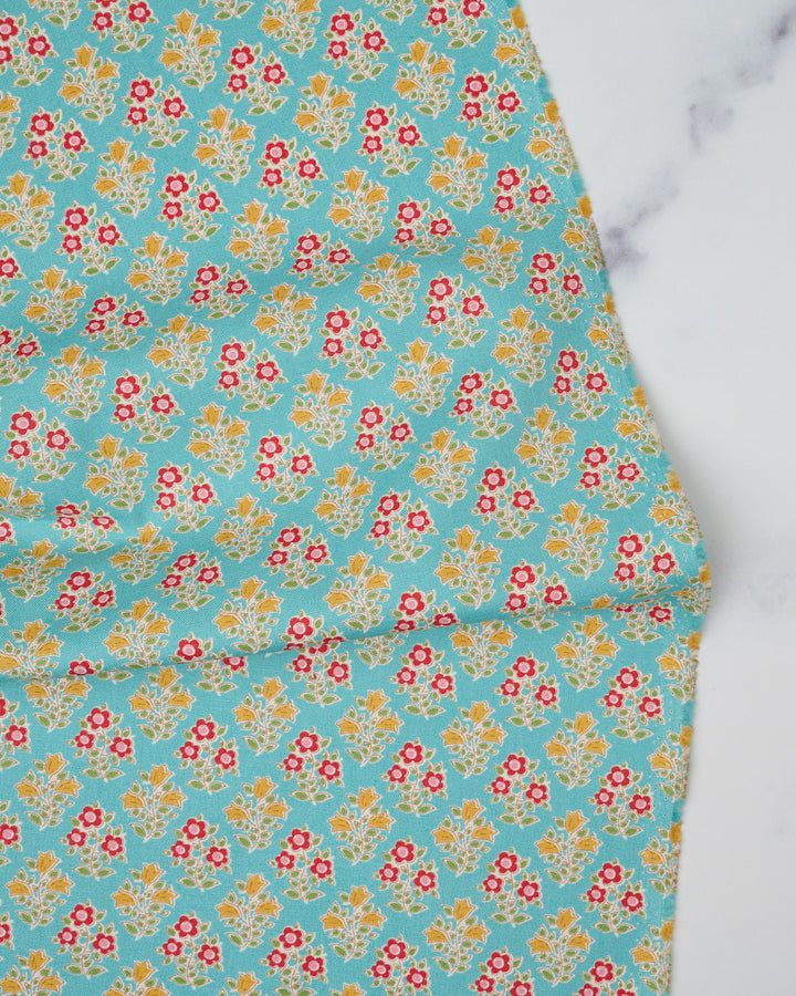 Cotton quilting fabric pattern called 'Farm Flowers in Teal'. Part of the 'Jubilee' fabric collection. Designed by Tilda Fabrics for fabric company Tilda Fabrics. SKU: 110103. 44-45 inch width.