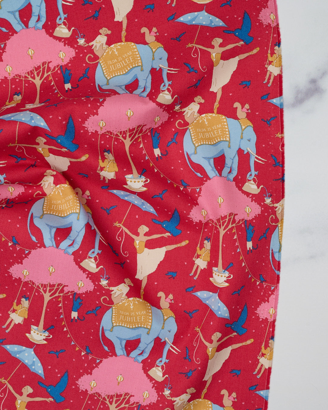 Cotton quilting fabric pattern called 'Circus Life Jubilee in Red'. Part of the 'Jubilee' fabric collection. Designed by Tilda Fabrics for fabric company Tilda Fabrics. SKU: 100543. 44-45 inch width.