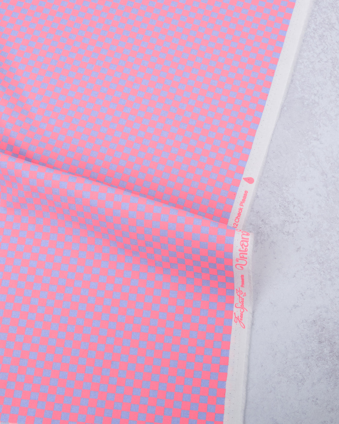 Cotton quilting fabric pattern called 'Check Please in Nova'. Part of the 'Untamed' fabric collection. Designed by Tula Pink for fabric company Free Spirit Fabrics. SKU: PWTP242.NOVA. 44-45 inch width.