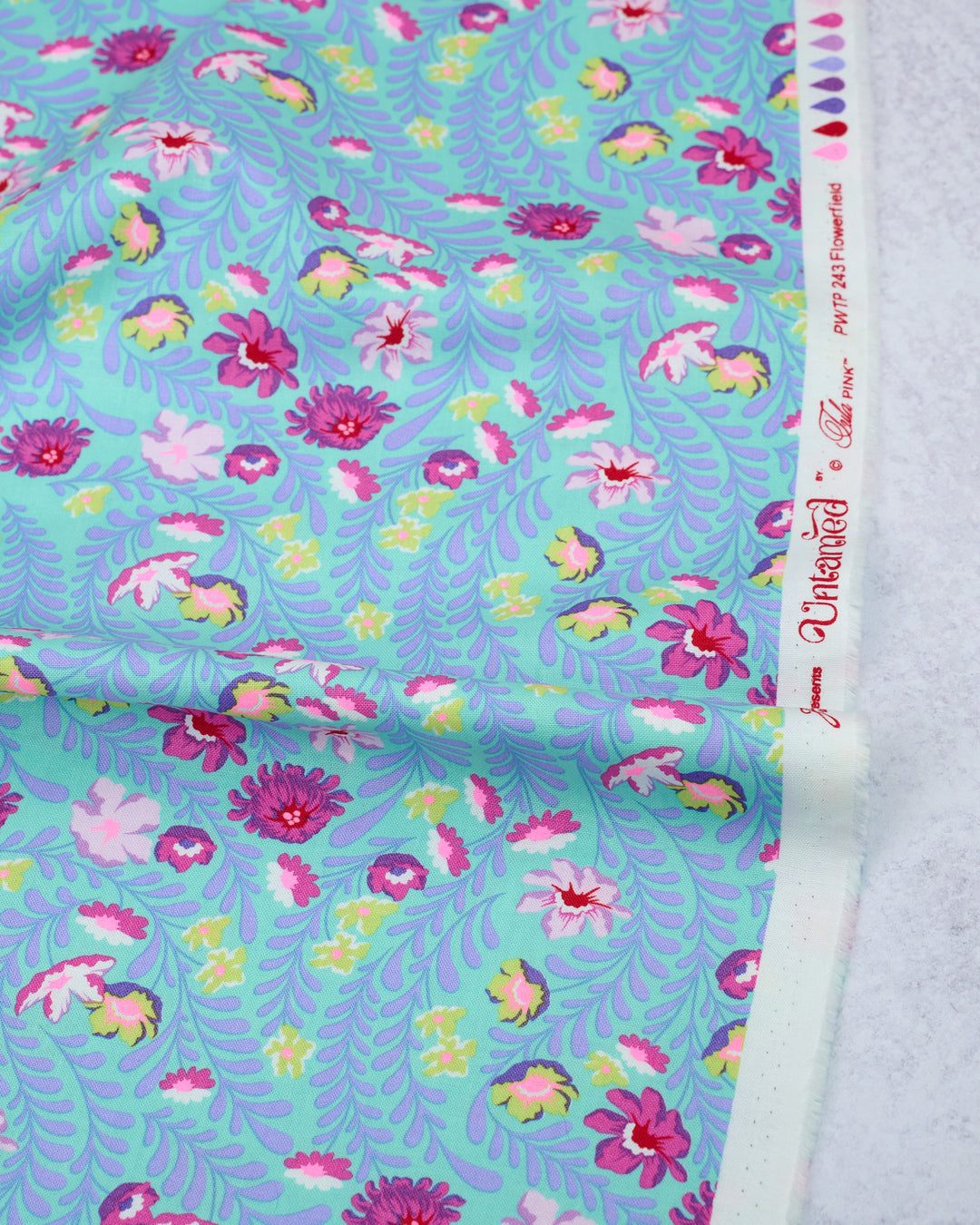 Cotton quilting fabric pattern called 'Flowerfield in Cosmic'. Part of the 'Untamed' fabric collection. Designed by Tula Pink for fabric company Free Spirit Fabrics. SKU: PWTP243.COSMIC. 44-45 inch width.