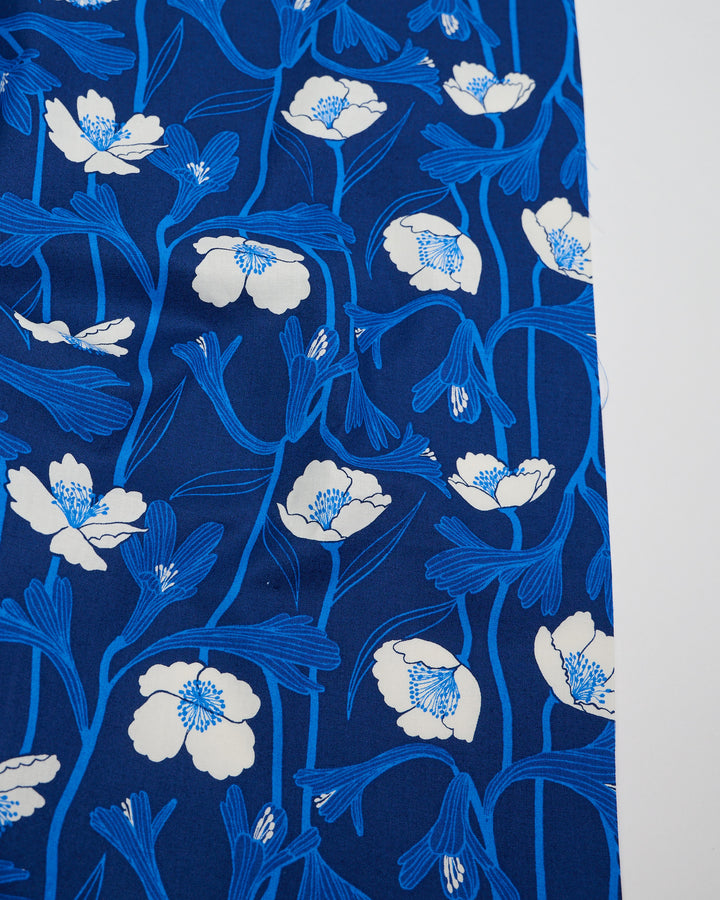 Cotton quilting fabric pattern called 'Water Water Flowers in Navy'. Part of the 'Water' fabric collection. Designed by Ruby Star Society for fabric company Moda Fabrics. SKU: RS5133 14. 44-45 inch width.