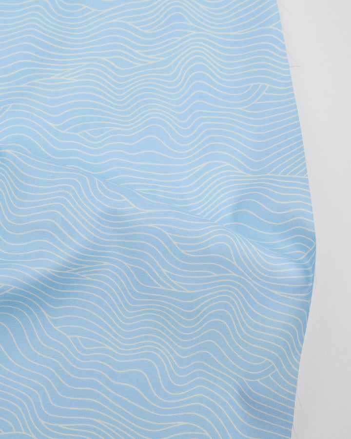 Cotton quilting fabric pattern called 'Water Wavelength in Water Blue'. Part of the 'Water' fabric collection. Designed by Ruby Star Society for fabric company Moda Fabrics. SKU: RS5129 15. 44-45 inch width.