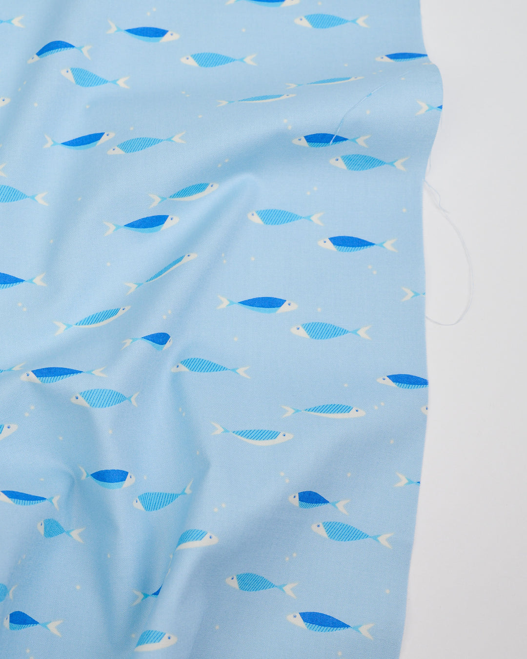 Cotton quilting fabric pattern called 'Water School Day in Water Blue'. Part of the 'Water' fabric collection. Designed by Ruby Star Society for fabric company Moda Fabrics. SKU: RS5127 11. 44-45 inch width.