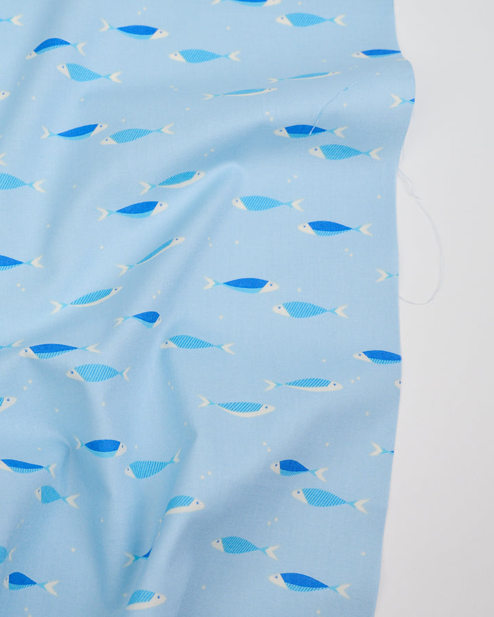 Cotton quilting fabric pattern called 'Water School Day in Water Blue'. Part of the 'Water' fabric collection. Designed by Ruby Star Society for fabric company Moda Fabrics. SKU: RS5127 11. 44-45 inch width.